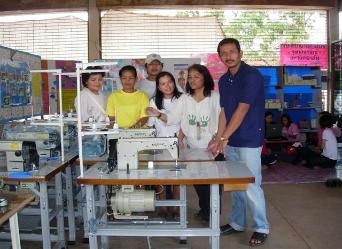 Maitree and helpers take delivery of 12 sewing machines